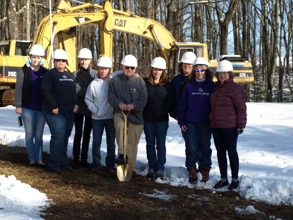 The Board of Directors celebrating groundbreaking for the new shelter. 